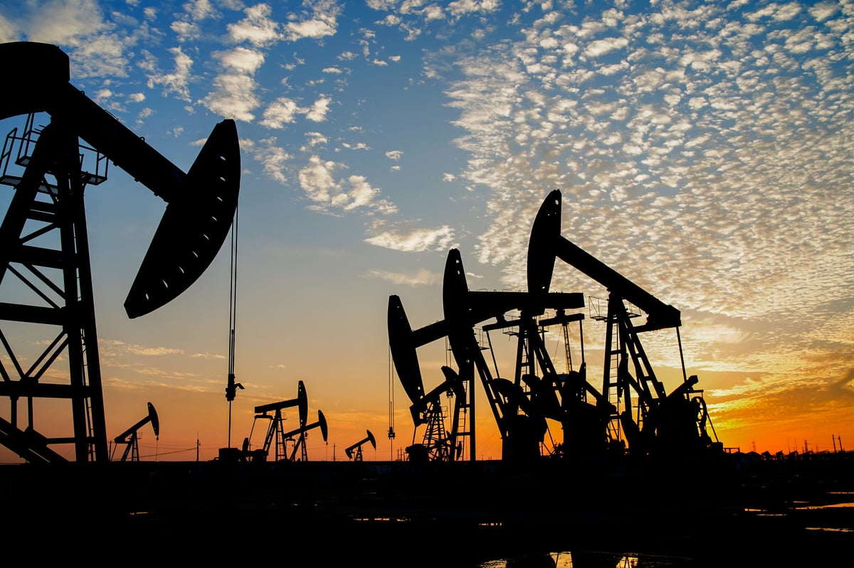 The oil pump, industrial equipment. Oil field site, oil pumps are runningExtraction of oil.